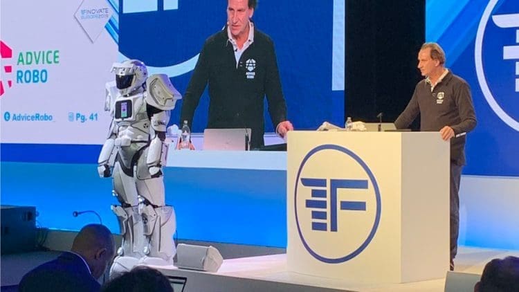 A robot standing next to Diederick of Advice Robo