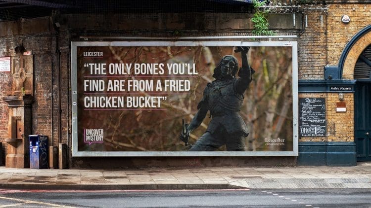 King Richard III holding his crown on statue on a poster