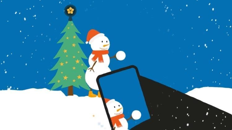 A snowman having his picture taken