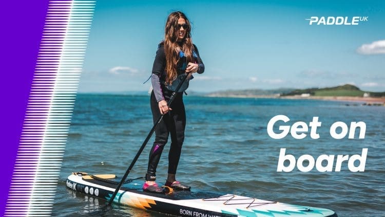 Get on board - visual of a woman on a paddle board