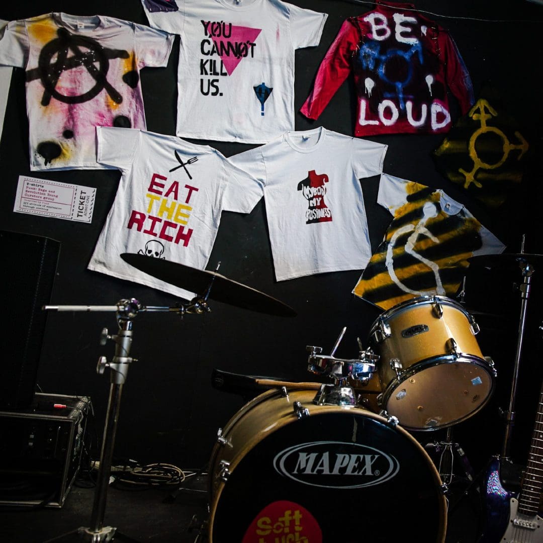 Display in the Punk exhibition at Soft Touch Arts featuring young people's art on t-shirts