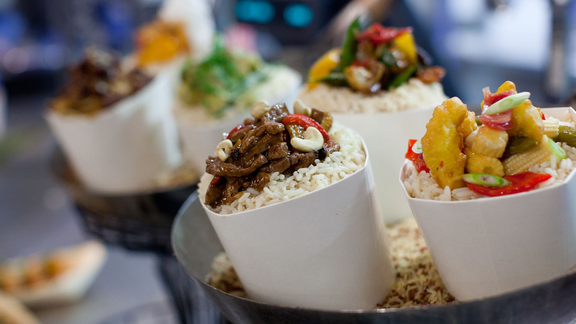 Small pot portions of stir fry and rice