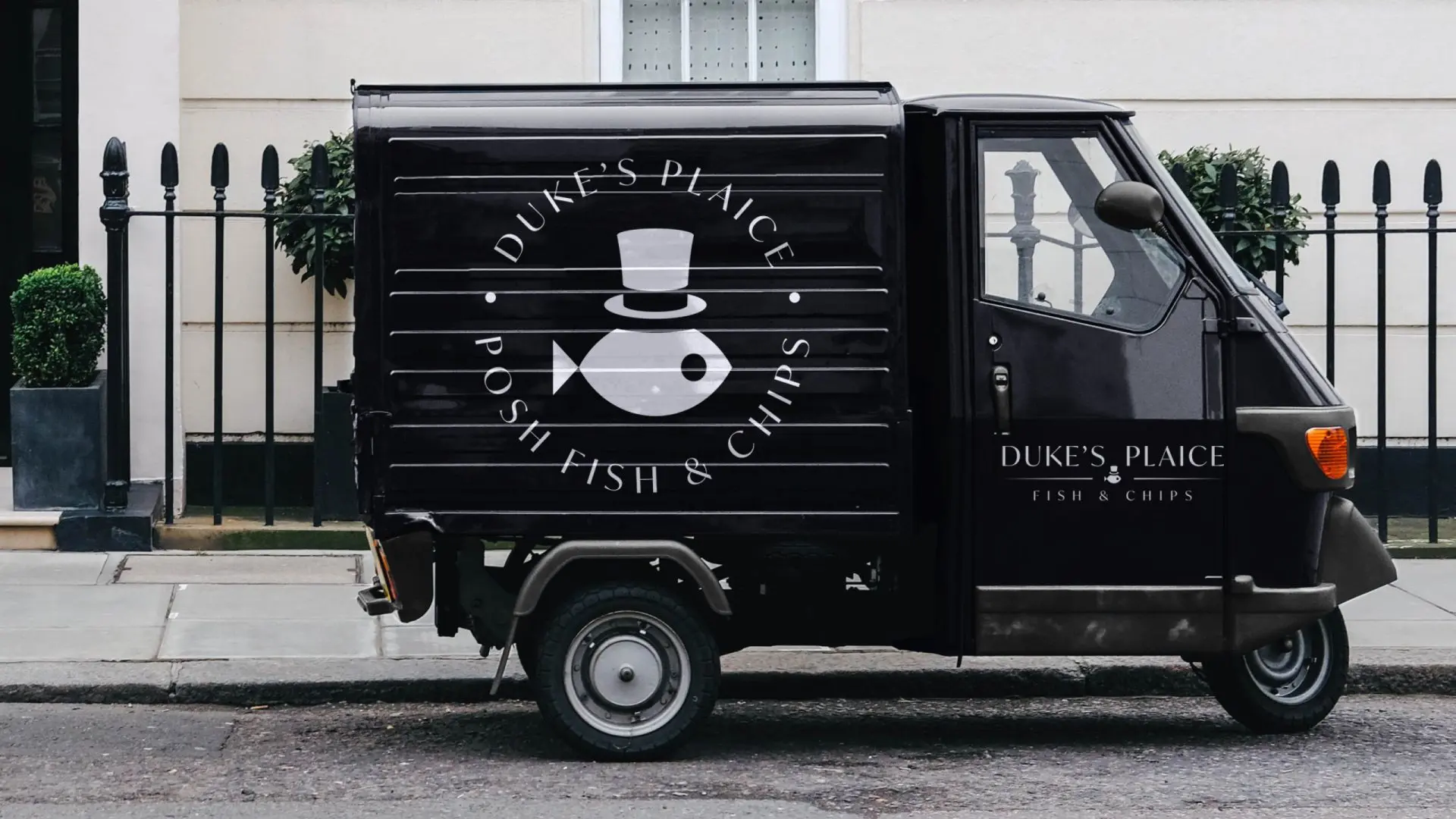 A small food van with Duke's Plaice logo on the side.