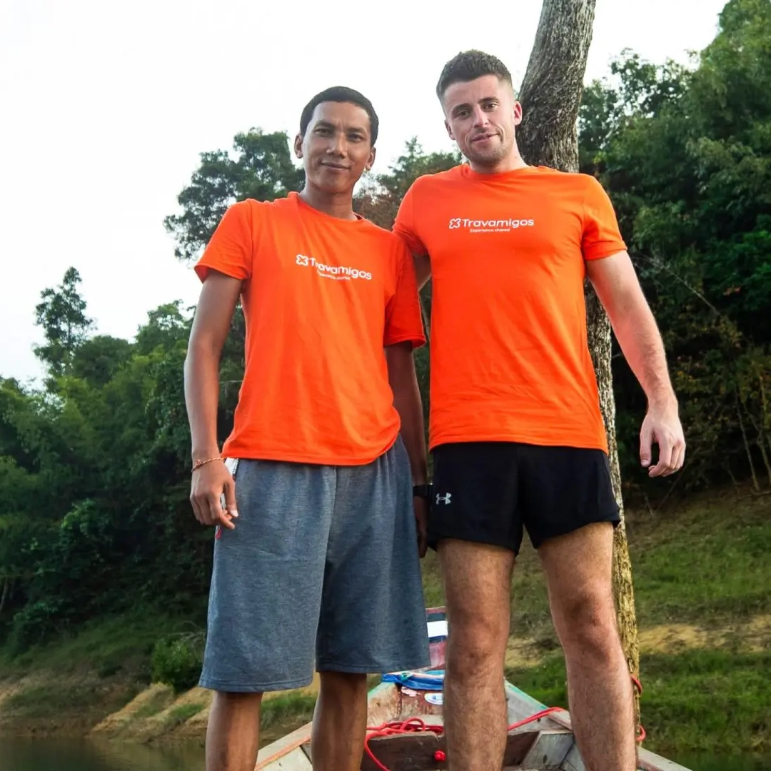 Two men posing in Travamigos tshirts